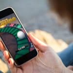 person playing roulette on their mobile device