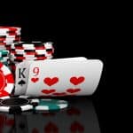 Baccarat game card combination natural 9 with casino chips on black table. 3D illustration