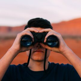 How Can I Watch Bridge - Man with binoculars - Great Bridge Links