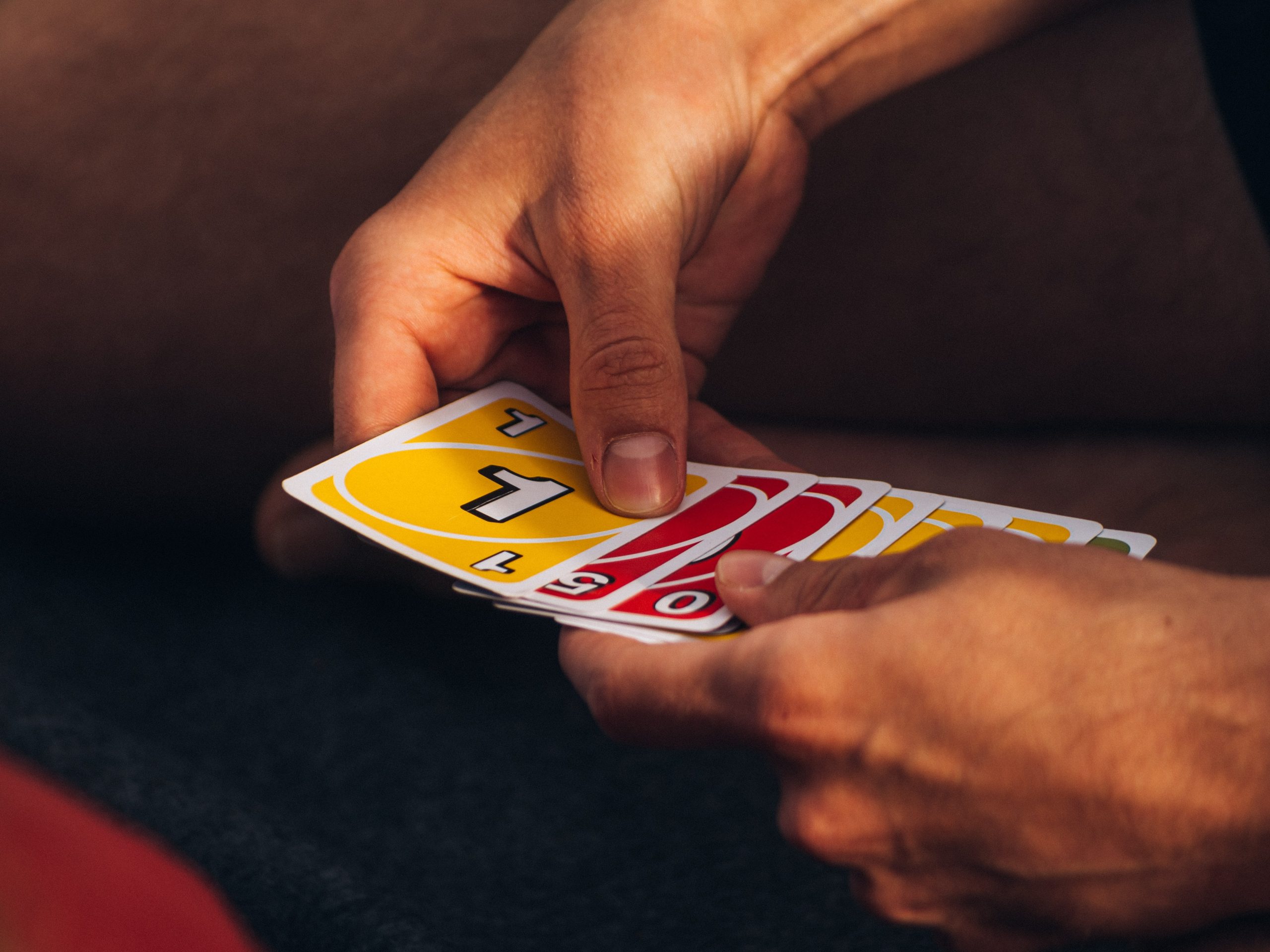 Playing American Card Game Uno, Holding Game Cards in Female Hand