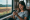 Photo of woman playing mobile games on her phone while riding on transit through the countryside for an article titled Innovations in Mobile Gaming and the Rise of Casino Apps