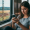 Photo of woman playing mobile games on her phone while riding on transit through the countryside for an article titled Innovations in Mobile Gaming and the Rise of Casino Apps