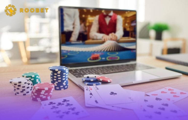 Someone playing card games at an online casino on their laptop