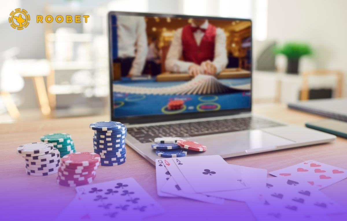 Someone playing card games at an online casino on their laptop