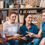 Rock Paper Scissors played by happy people
