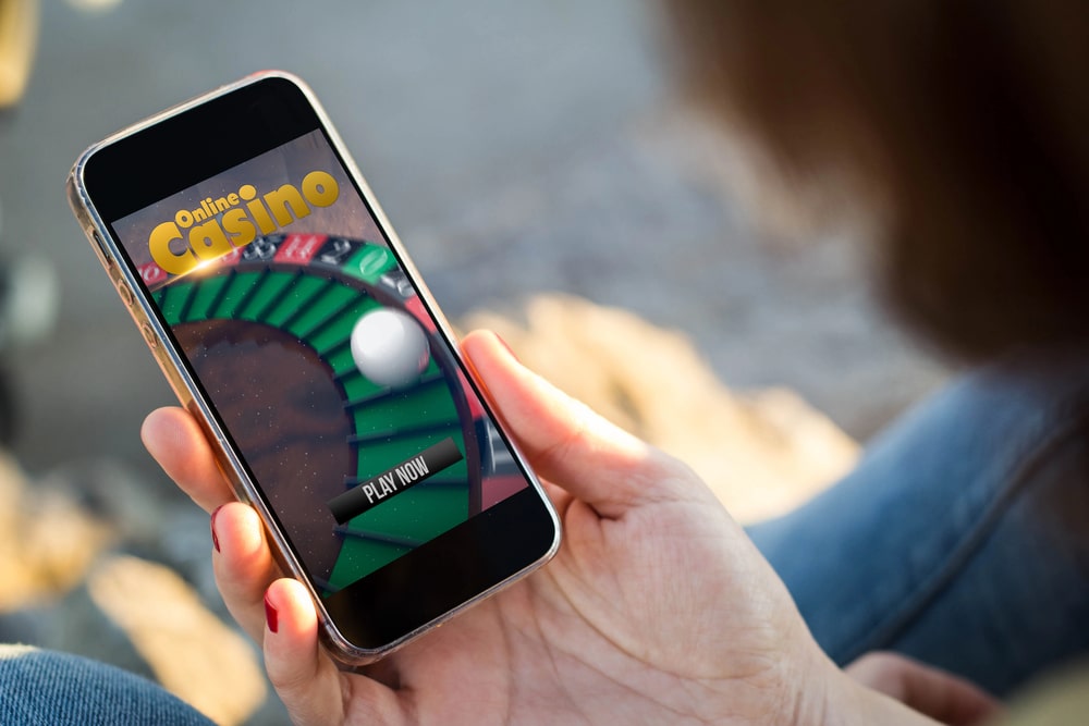 person playing roulette on their mobile device